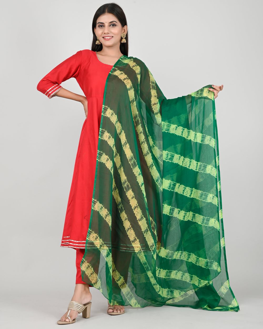 Woman wearing a vibrant traditional outfit and accessories