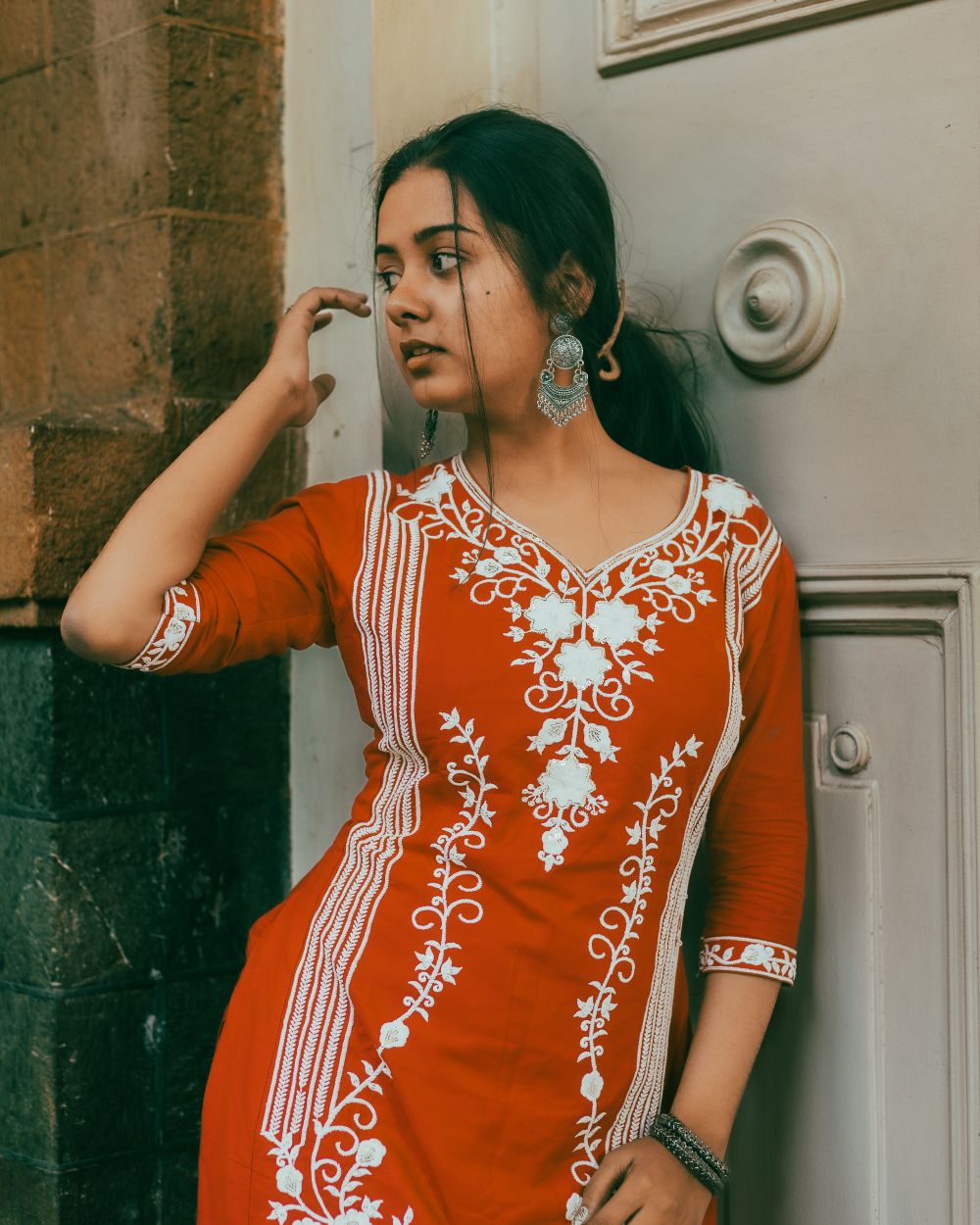 Woman in a red kurti styled for everyday wear
