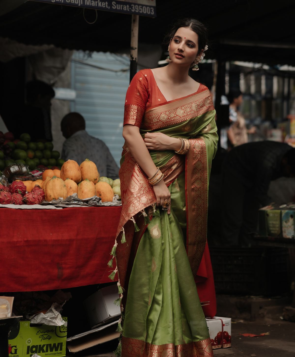 Woman in a saree visiting a colourful local market